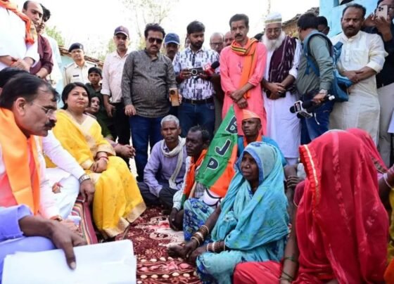 Sitting on the ground the MP passed the phone to the officer